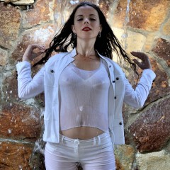 ufa217: Greta in white suit gets wet under the waterfall.