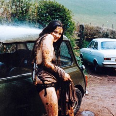 katew: Denise washes her car in a muddy layby