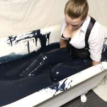 Stella: Stella strips down to nothing in a tub of black slime.