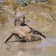 FOXY: A couple play in mud