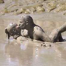FOXY: A couple play in mud