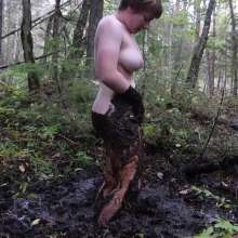 Stella: Stella splashes through forest swamp looking for a mud pit.