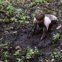 Stella: Stella splashes through forest swamp looking for a mud pit.