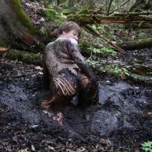 Stella: Stella splashes through forest swamp looking for a mud pit.