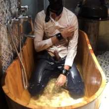 Daniel Wetlook: Daniel--formal Clothes in Wooden Bathtub