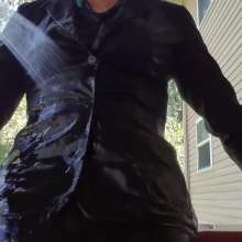 MadelineOasis: Oasis Video--Black Business Suit and Green Merrywidow