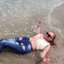 Wet_look_elena: Ripped Jeans  Stockings Heels and Small White Top in the Sea