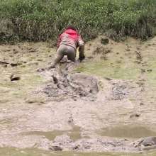 FOXY: Down jacket in deep mud