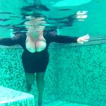 Wet_look_elena: Black Velvet Dress with Stockings in the Pool.