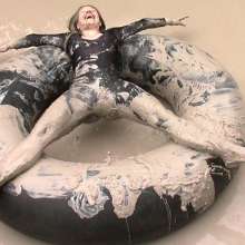 FOXY: video black unitard in mud