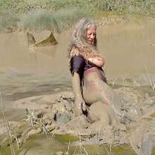 FOXY: In deep mud with red boots.