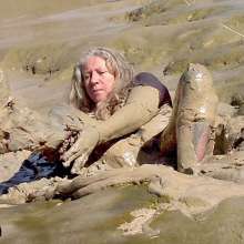 FOXY: In deep mud with red boots.