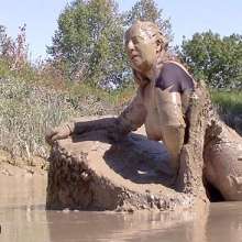 FOXY: In deep mud with red boots.