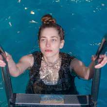 Wet Live Team: Natashka Swam in a Dress and Jacket in the Pool