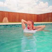 WetlookFashion: Krispeachi Gets Wet in a Sexy White Jumpsuit