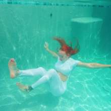 WetlookFashion: Krispeachi Gets Wet in a Sexy White Jumpsuit