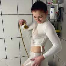 WetPlace: Marina Shower In Bathtub In White Clothes
