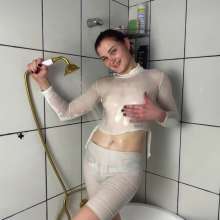 WetPlace: Marina Shower In Bathtub In White Clothes