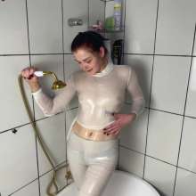 WetPlace: Marina Shower In Bathtub In White Clothes