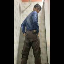 WETColours: Mike in the Shower in a Blue Shirt and Brown Pants