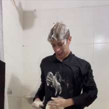 WETColours: Ostin Showers Wearing a Black Shirt and Using Shampoo