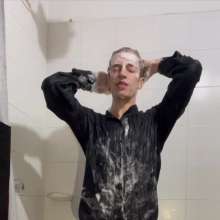 WETColours: Ostin Showers Wearing a Black Shirt and Using Shampoo