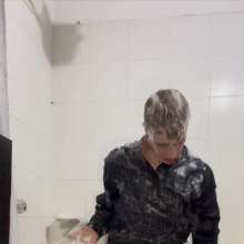 WETColours: Ostin Showers Wearing a Black Shirt and Using Shampoo