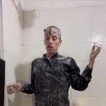 WETColours: Ostin Showers Wearing a Black Shirt and Using Shampoo