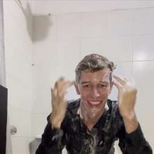 WETColours: Ostin Showers Wearing a Black Shirt and Using Shampoo