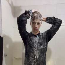 WETColours: Ostin Showers Wearing a Black Shirt and Using Shampoo