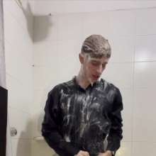 WETColours: Ostin Showers Wearing a Black Shirt and Using Shampoo