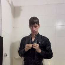 WETColours: Ostin Showers Wearing a Black Shirt and Using Shampoo
