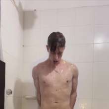 WETColours: Ostin Showers Wearing a Black Shirt and Using Shampoo