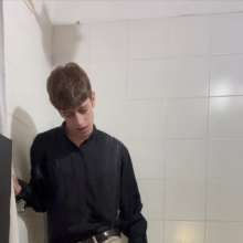 WETColours: Ostin Showers Wearing a Black Shirt and Using Shampoo