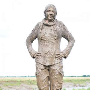 DungeonMasterOne: Mud: Chastity wears combats, heeled boots, white jumper, into the mudbanks!