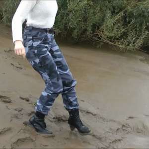 DungeonMasterOne: Mud: Chastity wears combats, heeled boots, white jumper, into the mudbanks!