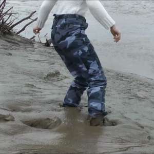 DungeonMasterOne: Mud: Chastity wears combats, heeled boots, white jumper, into the mudbanks!