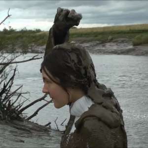 DungeonMasterOne: Mud: Chastity wears combats, heeled boots, white jumper, into the mudbanks!