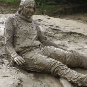 DungeonMasterOne: Mud: Chastity wears combats, heeled boots, white jumper, into the mudbanks!