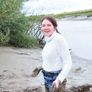 DungeonMasterOne: Mud: Chastity wears combats, heeled boots, white jumper, into the mudbanks!