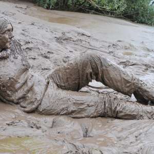 DungeonMasterOne: Mud: Chastity wears combats, heeled boots, white jumper, into the mudbanks!
