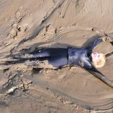DungeonMasterOne: Download: Blonde Felicity takes to the mudbanks in a Spandex catsuit!