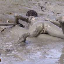 FOXY: white swimsuit in mud