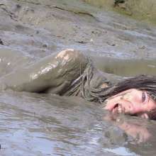 FOXY: white swimsuit in mud