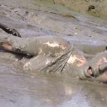 FOXY: white swimsuit in mud