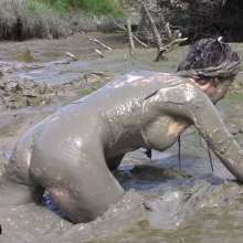 FOXY: white swimsuit in mud