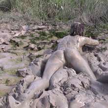 FOXY: white swimsuit in mud