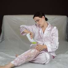 MessyCleo: Cleo drenches her pink satin pyjamas in baby oil