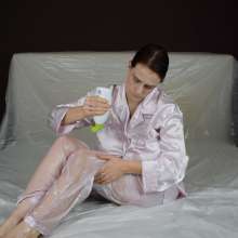 MessyCleo: Cleo drenches her pink satin pyjamas in baby oil