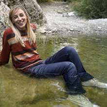 Ag Italian Wetlook: Elaine in river with Converse All Star, socks, jeans and sweaters